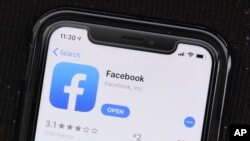 FILE - The ``News Tab'' section will appear in the Facebook mobile app. 