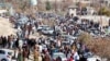 Afghan men leave after watching the public execution of a man by the Taliban at a football stadium in Gardez, in Paktia province, Nov. 13, 2024.