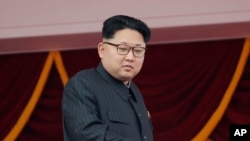 FILE - North Korea's leader Kim Jong Un watches a parade in Pyongyang, May 10, 2016. 