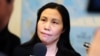 中国人权活动人士郭飞雄的妻子张青参加众议院外交关系委员会听证会前接受记者采访。 （2013年10月29日） 