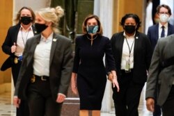 U.S. House Speaker Nancy Pelosi (D-CA) walks to the House Chamber as Democrats debate an article of impeachment against President Donald Trump at the Capitol, in Washington, D.C.