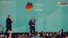 German conservative candidate for chancellor and Christian Democratic Union party leader Friedrich Merz walks on stage after the exit poll results are announced in the German general elections in Berlin, Feb. 23, 2025.