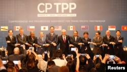 Les représentants des pays membres du nouvel accord commercial du Partenariat transpacifique (TPP)