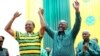 Tanzania's public works minister John Pombe Magufuli, right, celebrates with President Jakaya Kikwete, left, after the ruling party announced its presidential candidate, in Dodoma, Tanzania, July 12, 2015.