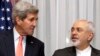 FILE - U.S. Secretary of State John Kerry, left, listens to Iran's Foreign Minister Mohammad Javad Zarif, right, March 16, 2015 in Lausanne, Switzerland.