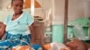 Antho watches over her son Kaba, two, who is being treated for cerebral malaria at the Tshilundu Referral Hospital in Kasai Oriental Province, DRC. Kaba is now in a coma. Antho is nine months pregnant. This is her eighth pregnancy; she had two miscarriages and a daughter who died of malaria aged just eleven months because the clinic they took her to was closed when they arrived. This is not unusual: many local clinics in DRC are under equipped and under staffed. (Credit: Ivy Lahon / Save the Children)