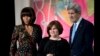 In this March 8, 2013 file photo, Russian human rights activist, journalist Elena Milashina, is honored at the State Department in Washington by then First lady Michelle Obama and Secretary of State John Kerry.
