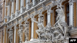 FILE - This photo taken on Oct. 12, 2022, shows sculptures at the Odesa Passage, a shopping arcade and a hotel in the center of the Ukrainian city of Odesa.