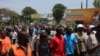FILE - Protesters march against the rising cost of living and poor governance, in Blantyre, Malawi, Oct. 27, 2022. 