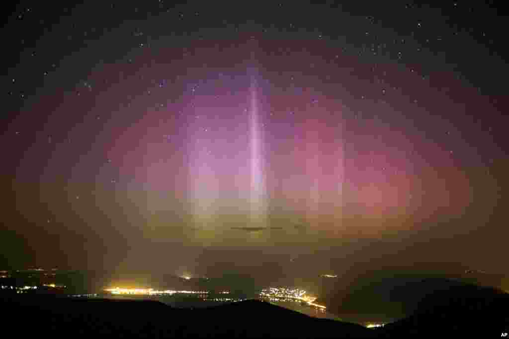 The Northern Lights (Aurora borealis) are seen in the sky above Pilisszentkereszt, 26 kms north of Budapest, Hungary.