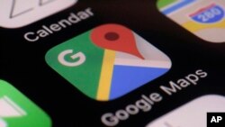 This photo taken March 22, 2017, shows the Google Maps app on a smartphone in New York. Google is enabling users of its digital mapping service to allow their movements to be tracked by friends and family in the latest test of how much privacy people are 