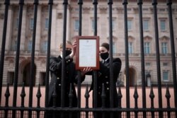 An announcement is attached to the fence of Buckingham Palace stating that Britain's Prince Philip, husband of Queen Elizabeth, has died at the age of 99, in London, Britain.