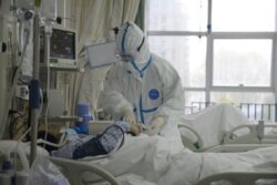 A picture released by the Central Hospital of Wuhan shows medical staff attending to patient at the The Central Hospital Of Wuhan Via Weibo in Wuhan, China on an unknown date.