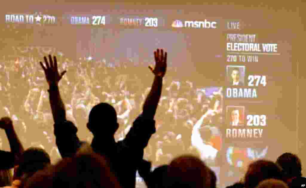 Arizona Democrats celebrate as President Barack Obama is declared the winner of the presidential race at a Democratic Party gathering in Tucson, Arizona, Tuesday, Nov. 6, 2012.