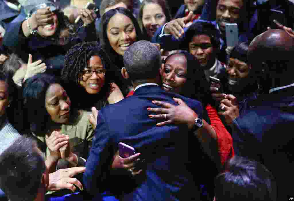 President Barack Obama is embraced by a woman in the crowd as he greets supporters after his farewell address at McCormick Place in Chicago, Jan. 10, 2017.