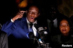 FILE - Zimbabwe's former vice president, Emmerson Mnangagwa, who is to be sworn in to replace Robert Mugabe as president, addresses supporters in Harare, Zimbabwe, Nov. 22, 2017.