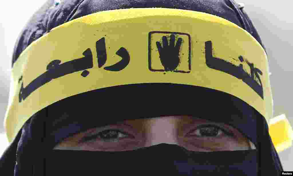 A supporter of the Muslim Brotherhood and ousted Egyptian President Mohamed Morsi shouts slogans outside the police academy, where Morsi's trial took place, on the outskirts of Cairo, Nov. 4, 2013.