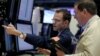 Traders work on the floor of the New York Stock Exchange (NYSE) in New York City, U.S., April 28, 2016. 