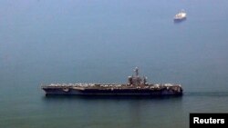 The US aircraft carrier USS Carl Vinson arrives at a port in Danang, Vietnam March 5, 2018.