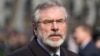 Sinn Fein president Gerry Adams arrives at the funeral of veteran British Labour politician Tony Benn at St. Margaret's Church, Westminster Abbey in London, March 27, 2014.