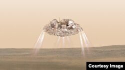 The Schiaparelli module with thrusters firing is shown landing in this artist impression released July 14, 2016. (Image courtesy of ESA/ATG medialab)