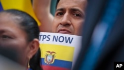 A supporter amongst a coalition of community leaders and immigrant advocates demonstrates outside U.S. immigration offices, calling on federal authorities to designate Ecuador for Temporary Protected Status (TPS) for its nationals in the aftermath of an earthquake, in New York, June 1, 2016.
