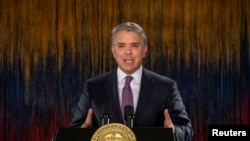 FILE - Colombia's President Ivan Duque addresses the nation in a televised speech, in Bogota, Colombia, Nov. 22, 2019.