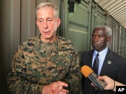 Gen. Thomas D. Waldhauser, left, commander of U.S. Africa Command, is joined by U.S. Ambassador to Senegal Tulinabo S. Mushingi, right, while speaking during a tour of a cooperative security location Camp Cisse.