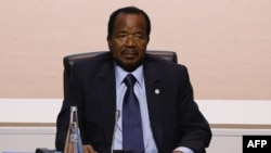 FILE - Cameroon's President Paul Biya attends a session of the One Planet Summit, Dec. 12, 2017, at La Seine Musicale venue on l'ile Seguin in Boulogne-Billancourt, west of Paris.