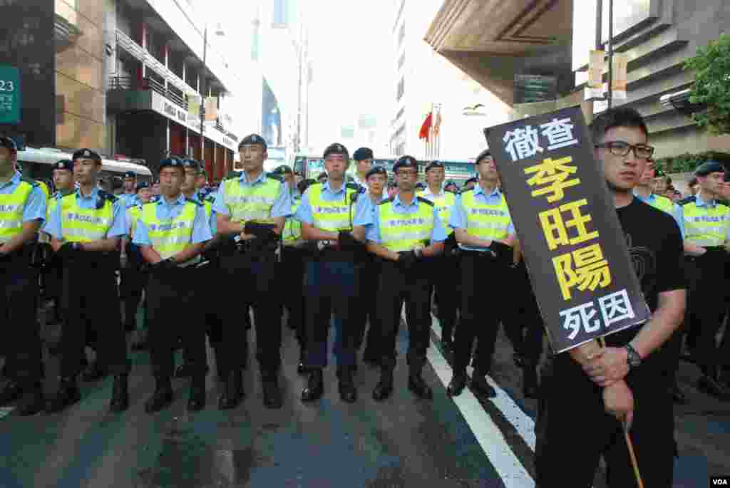 Protesters confront police.