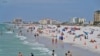 Beachgoers take advantage of the sun, sand, and surf as they spend time on Clearwater Beach, March 2, 2021, in Clearwater, Fla., a popular spring break destination, west of Tampa.