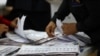 Ecuador's conservative incumbent and a leftist lawyer advance to presidential runoff