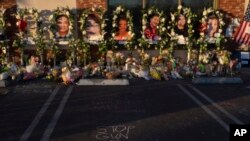 FILE - Messages are written at a memorial outside Star Dance Studio in Monterey Park, California, Thursday, January 26, 2023. The U.S. is setting a record pace for mass killings in 2023. (AP Photo/Jae C. Hong, File)