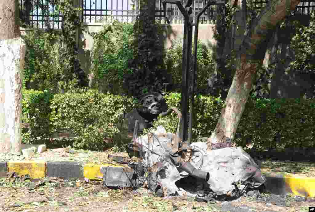 Twin blasts targeting Syria's army command headquarters rocked the capital on Sept. 26, setting off hours of sporadic gunbattles and a raging fire inside the heavily guarded compound, state-run media and witnesses said.
