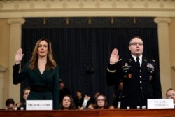 Jennifer Williams, an aide to Vice President Mike Pence, left, and National Security Council aide Lt. Col. Alexander Vindman, are sworn in to testify before the House Intelligence Committee on Capitol Hill in Washington, Nov. 19, 2019.