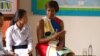 លោកស្រី Michelle Obama ភរិយា​លោក​ប្រធានាធិបតី​សហរដ្ឋ​អាមេរិក​ពិភាក្សា​ជាមួយ​សិស្ស​ស្រី​ខ្មែរ​នៅ​​​វិទ្យាល័យ​ហ៊ុន​ សែន​ប្រាសាទ​បាគង​នៅ​ជាង​ក្រុង​សៀមរាប កាល​ពី​ព្រឹក​ថ្ងៃ​សៅរ៍​ទី​២១ ខែ​មីនា ឆ្នាំ​២០១៥ ដើម្បី​លើក​ស្ទួយ​កម្មវិធី​អប់រំ​ ‍«គម្រោង​ផ្តល់​ឱកាស​ឲ្យ​សិស្ស​ស្រី​បាន​សិក្សា» ឬ "Let Girls Learn"។ (នៅ​ វណ្ណារិន/VOA)