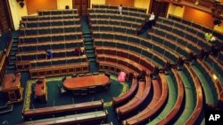 FILE - Workers clean inside the Egyptian parliament in Cairo, Egypt, July 9, 2012. 