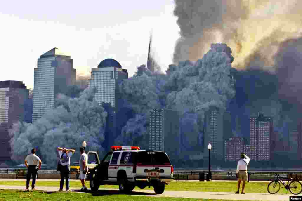 The remaining tower of New York's World Trade Center, Tower 2, dissolves in a cloud of dust and debris about a half hour after the first twin tower collapsed.