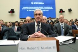 Former special counsel Robert Mueller listens to committee members give their opening remarks before he testifies before the House Intelligence Committee on his report on Russian election interference, on Capitol Hill, in Washington, July 24, 2019.