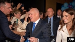 This picture taken on Oct. 14, 2023 shows New Zealand's National party leader Christopher Luxon interacting with his supporters after winning the 2023 New Zealand general election, during a party event in Auckland.