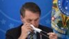 Le président brésilien Jair Bolsonaro avant une conférence de presse sur le coronavirus au Palais présidentiel Planalto à Brasilia, le 18 mars 2020. (Photo AP)