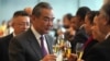 China's Foreign Minister Wang Yi toasts with Nauru diplomats after signing the joint communiqué on the resumption of diplomatic relations between the People's Republic of China and the Republic of Nauru at the Diaoyutai State Guesthouse in Beijing on Jan. 24, 2024.