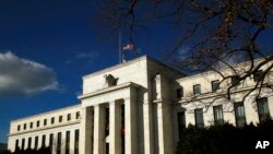 FILE - The Federal Reserve building is seen during a partial government shutdown in Washington, Dec. 24, 2018. 