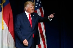FILE - Former President Donald Trump acknowledges the crowd as he speaks at the North Carolina Republican Convention, June 5, 2021, in Greenville, N.C.