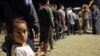 Thousands of Syrian Kurds Flee to Iraq to Escape Turkish Incursion