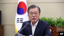 FILE - South Korean President Moon Jae-in speaks during a meeting with his senior aides at the presidential Blue House in Seoul, South Korea, Aug. 5, 2019. 