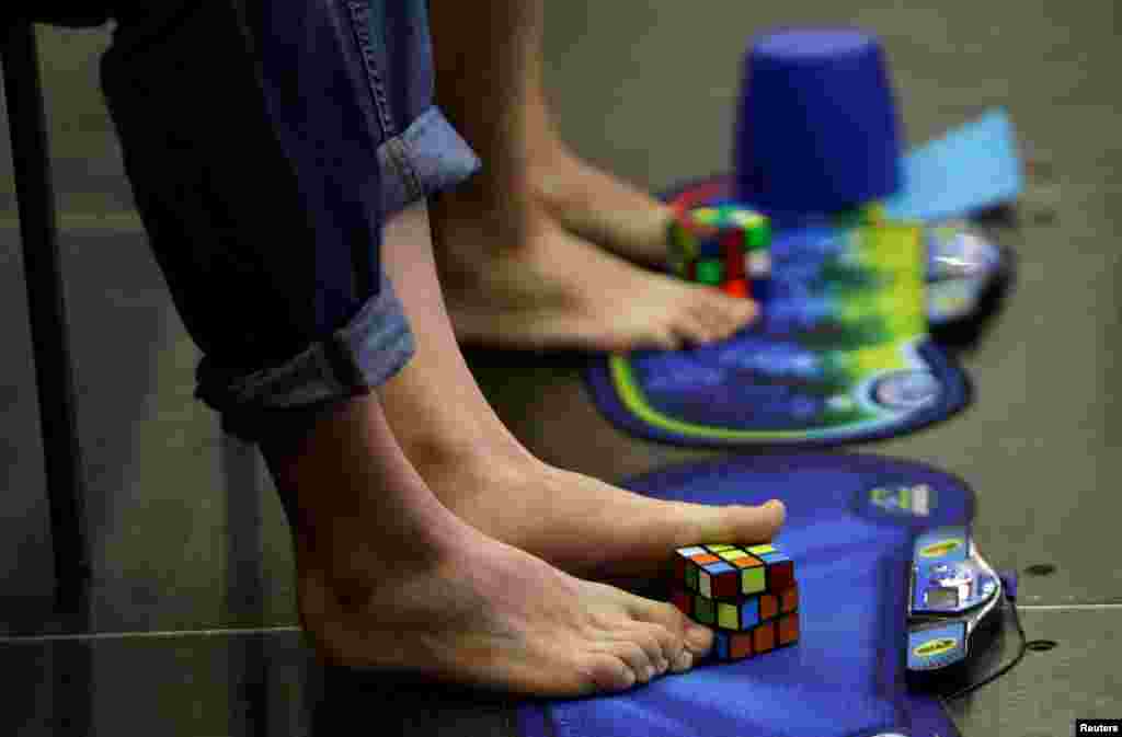 Competitors solve Rubik's cubes using their feet during the Rubik's Cube European Championship in Prague, Czech Republic.