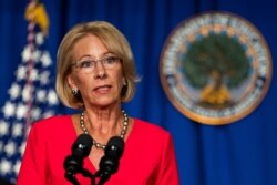 FILE - Education Secretary Betsy DeVos speaks during a White House Coronavirus Task Force briefing at the Department of Education building, in Washington, July 8, 2020.