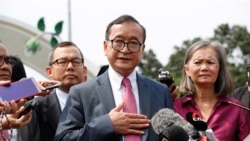 FILE - Sam Rainsy, self-exiled founder of the opposition Cambodia National Rescue Party (CNRP) and its deputy president, Mu Sochua, speak to members of the media in Kuala Lumpur, Malaysia, Nov. 12, 2019.