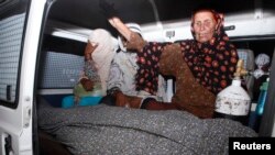 Women mourn over the body Women mourn over the body of their relative, Farzana Parveen, who was killed by family members, in an ambulance outside of a morgue in Lahore May 27, 2014.of their relative, Farzana Iqbal, who was killed by family members, in an 